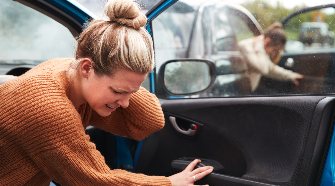 women experiencing whiplash injury claim after a car accident.